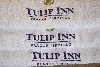 ručník s výšivkou loga Tulip Inn